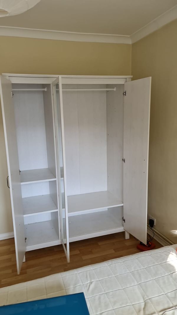 Wardrobe interior with shelves and hanging rails