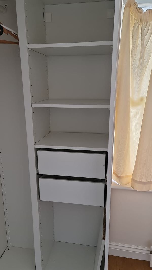 Fitted wardrobe with hanging rail installed